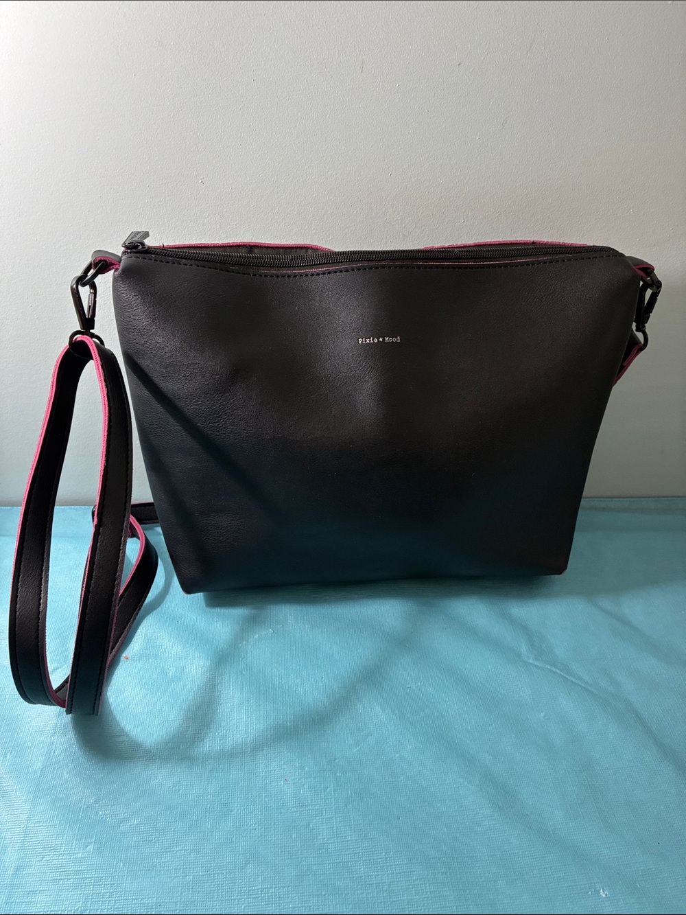 Pixie Mood Black Crossbody Bag with Pink Trim and Adjustable Strap
